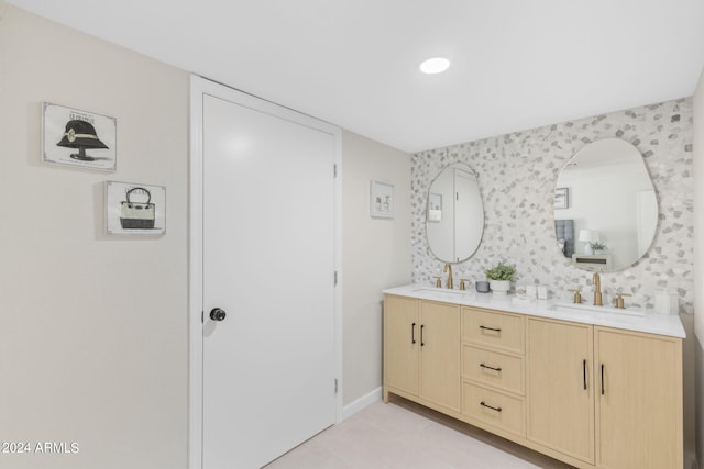 bathroom with tile patterned flooring and vanity