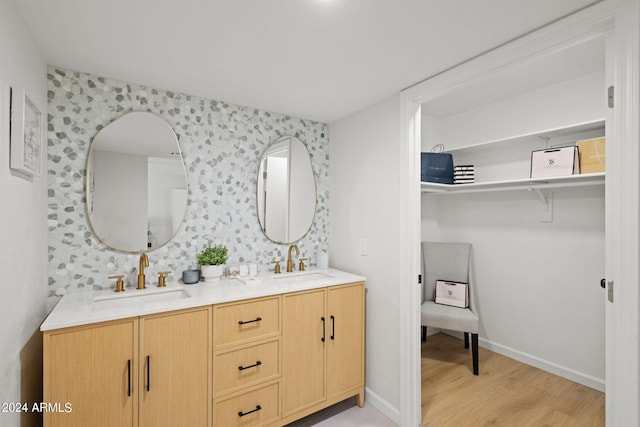 bathroom with wood-type flooring and vanity