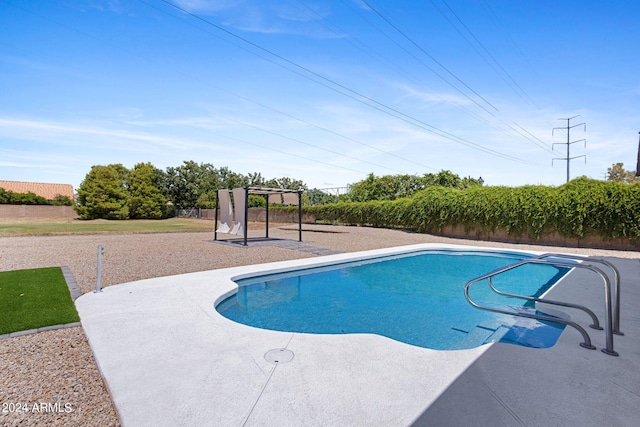 view of swimming pool featuring a patio