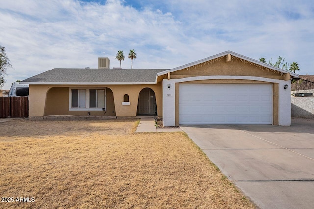 single story home featuring stucco siding, a shingled roof, fence, a garage, and driveway