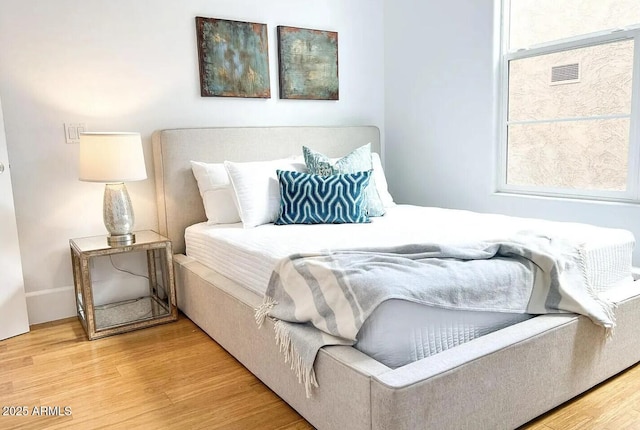 bedroom featuring hardwood / wood-style flooring