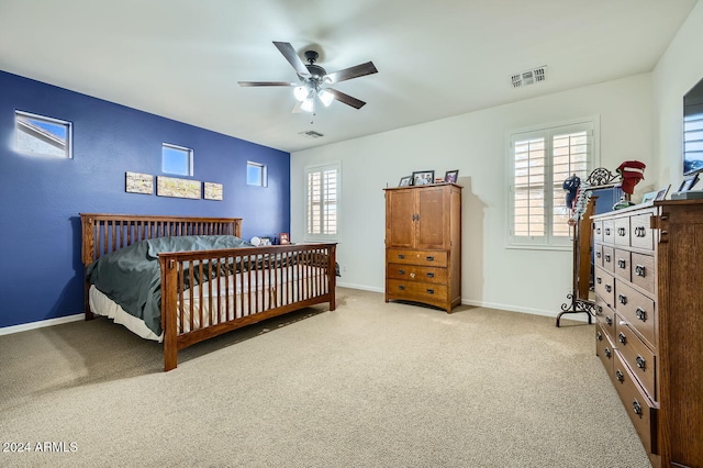 carpeted bedroom featuring ceiling fan