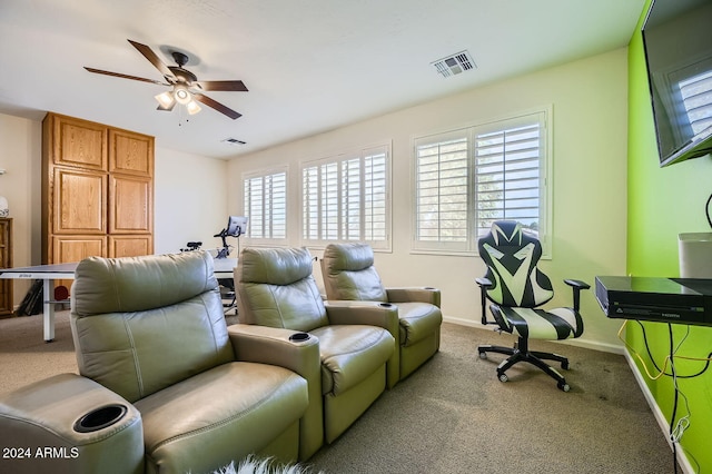 interior space featuring light carpet and ceiling fan