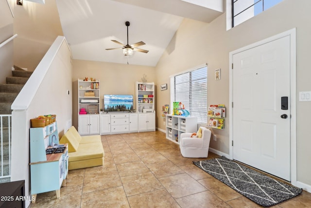 1344 N Brittany Ln, Gilbert, AZ 85233 - entrance foyer with a ceiling fan, stairs, high vaulted ceiling, and light tile patterned floors