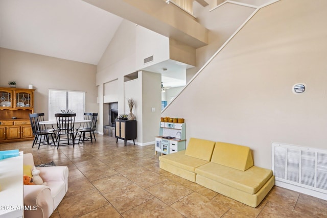 1344 N Brittany Ln, Gilbert, AZ 85233 - living area featuring high vaulted ceiling, light tile patterned flooring, and baseboards