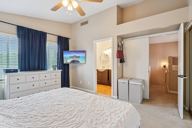 1344 N Brittany Ln, Gilbert, AZ 85233 - bedroom featuring light carpet, baseboards, ensuite bath, a sink, and vaulted ceiling