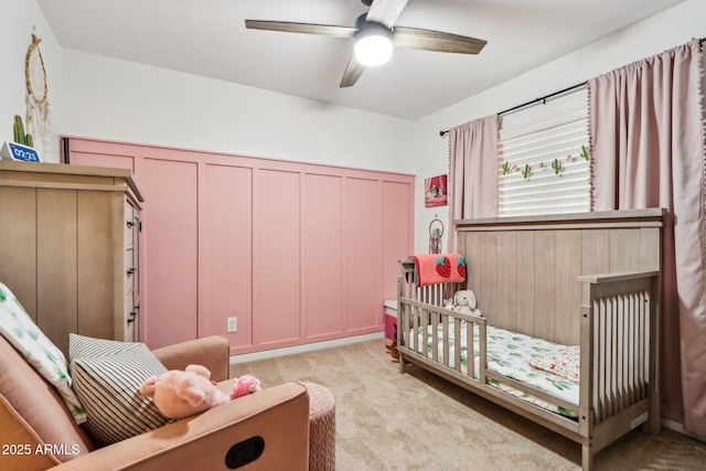 1344 N Brittany Ln, Gilbert, AZ 85233 - bedroom with light carpet, a nursery area, and ceiling fan