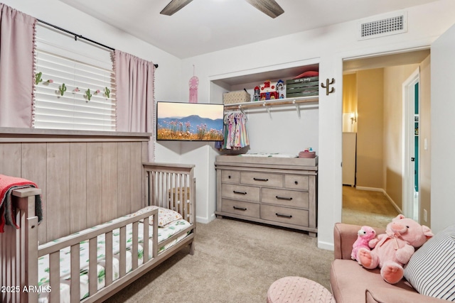 1344 N Brittany Ln, Gilbert, AZ 85233 - carpeted bedroom with a closet, a nursery area, and a ceiling fan