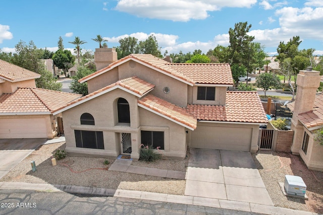 1344 N Brittany Ln, Gilbert, AZ 85233 - mediterranean / spanish house featuring driveway, stucco siding, a tile roof, a chimney, and a garage