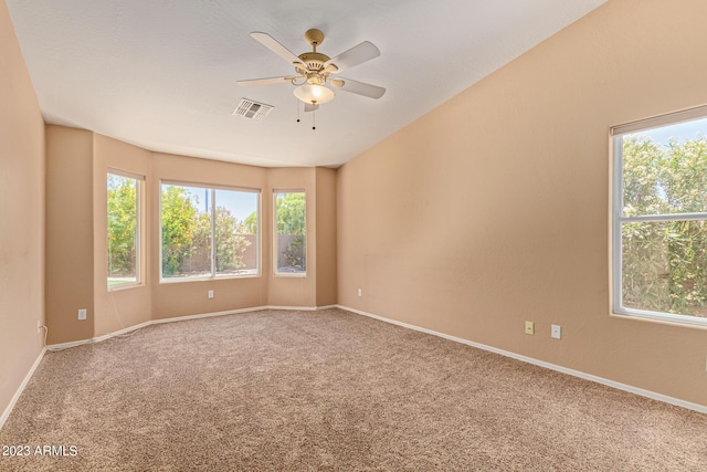 spare room featuring ceiling fan and carpet floors