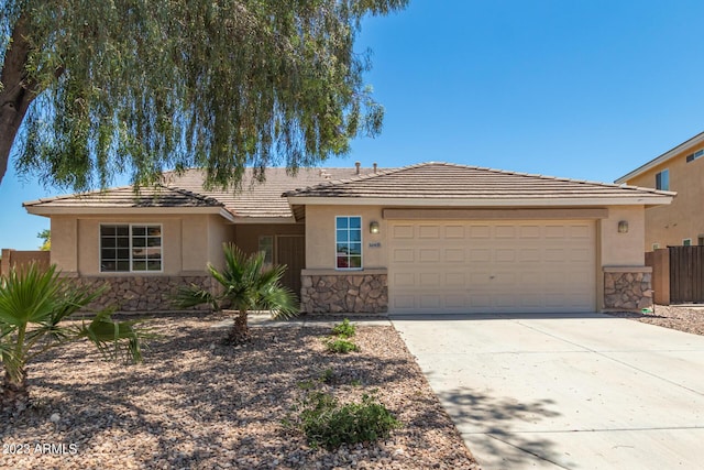 ranch-style house featuring a garage