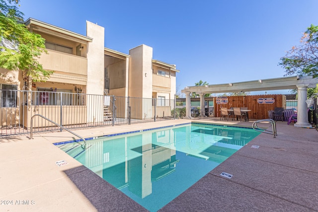 view of swimming pool featuring a patio area