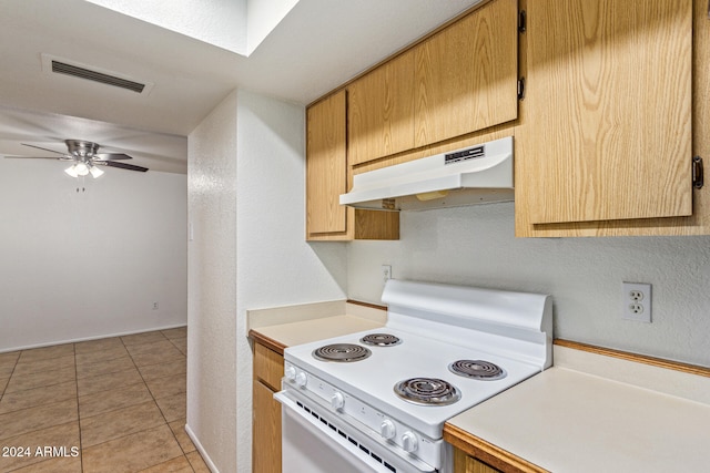 kitchen featuring electric range, ceiling fan, and light tile patterned flooring