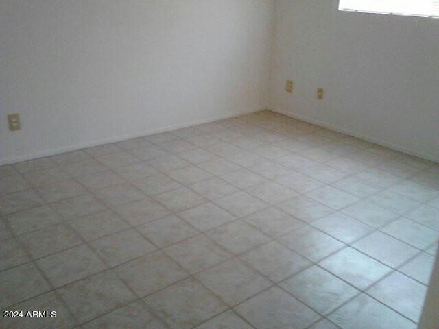 spare room featuring tile flooring