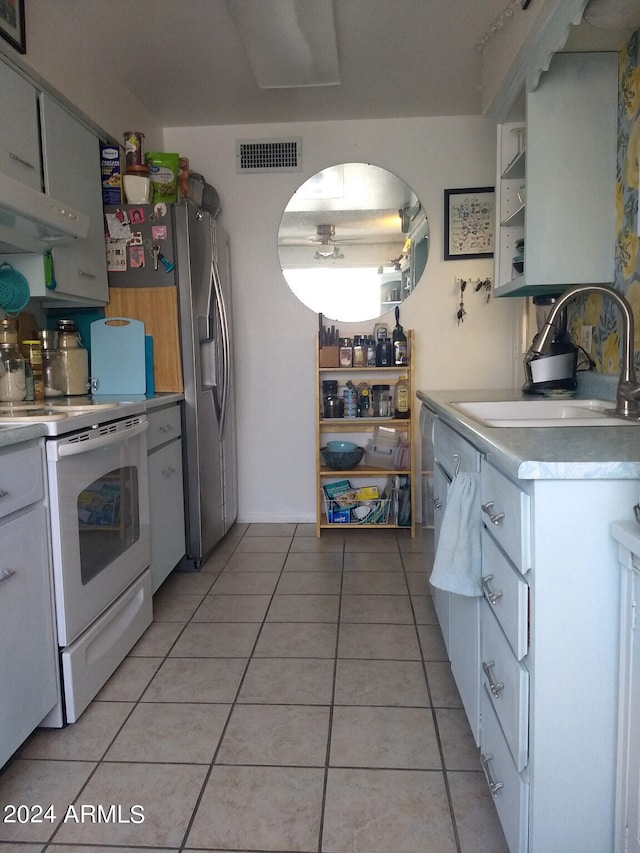 kitchen featuring stainless steel counters, fume extractor, sink, electric stove, and light tile floors