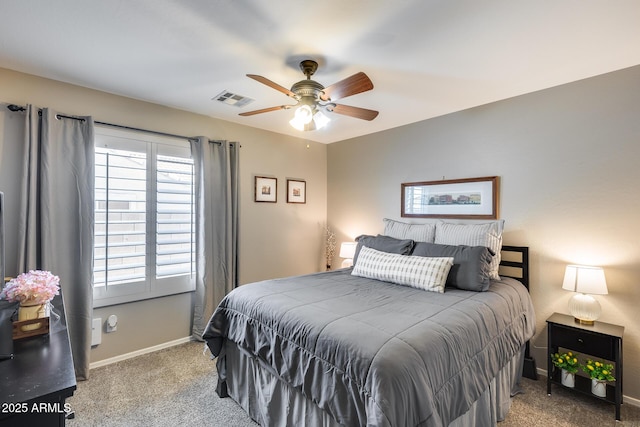 carpeted bedroom with ceiling fan, baseboards, multiple windows, and visible vents