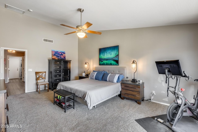bedroom featuring high vaulted ceiling, a ceiling fan, visible vents, carpet flooring, and baseboards