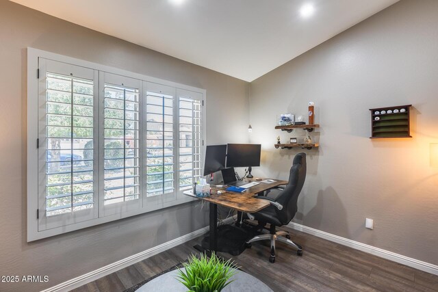 office with lofted ceiling, baseboards, and wood finished floors