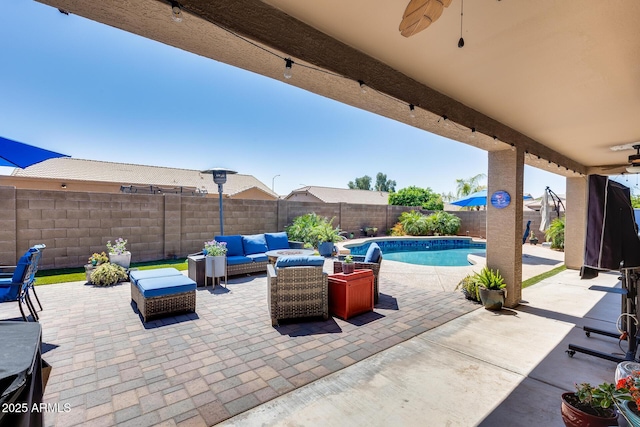 view of patio / terrace featuring a fenced backyard, an outdoor living space, a fenced in pool, and ceiling fan