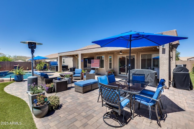 view of patio / terrace with an outdoor hangout area, a fenced backyard, grilling area, a fenced in pool, and outdoor dining area