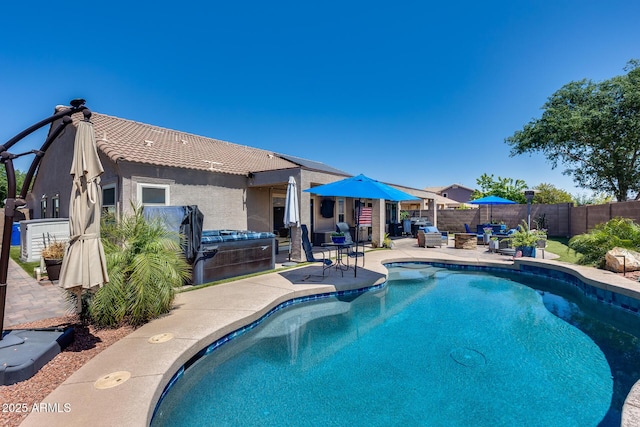 view of swimming pool with a patio area, a jacuzzi, a fenced backyard, and a fenced in pool