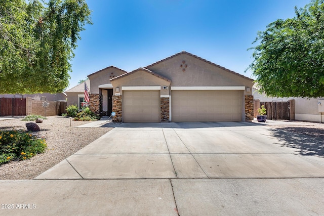 single story home featuring stucco siding, stone siding, fence, a garage, and concrete driveway