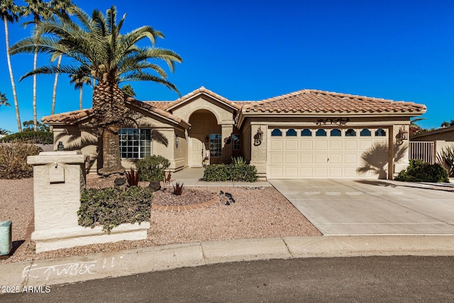 mediterranean / spanish-style home featuring a garage