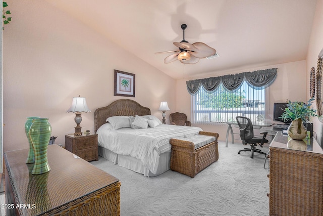 bedroom with ceiling fan, lofted ceiling, and carpet floors