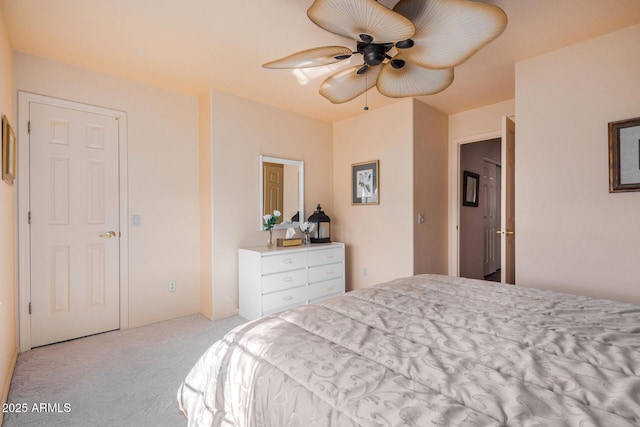 bedroom featuring ceiling fan and light colored carpet