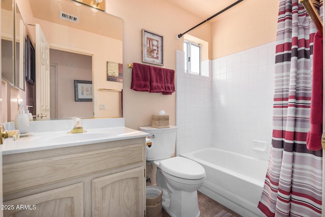 full bathroom with toilet, vanity, and shower / tub combo with curtain