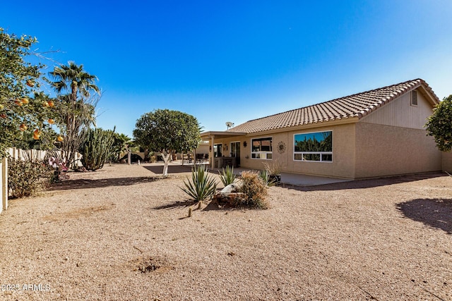 back of property featuring a patio