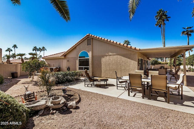 rear view of house with a patio