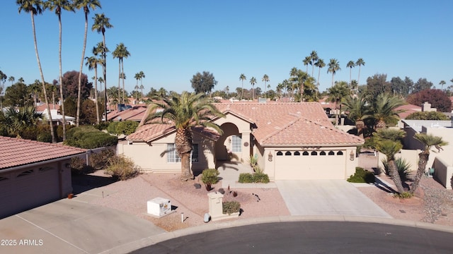 mediterranean / spanish-style house featuring a garage