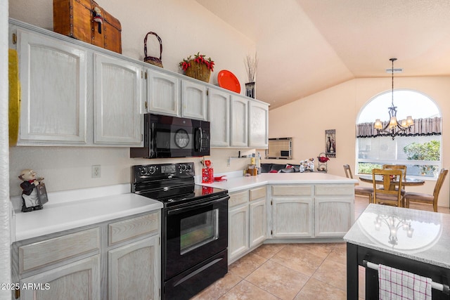 kitchen featuring vaulted ceiling, pendant lighting, black appliances, kitchen peninsula, and light tile patterned floors