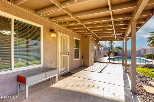 view of patio / terrace featuring fence and a fenced in pool