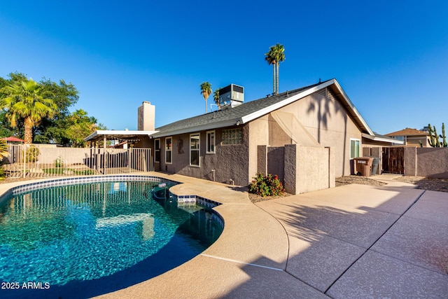 view of pool featuring a fenced in pool, central AC, a patio area, and fence