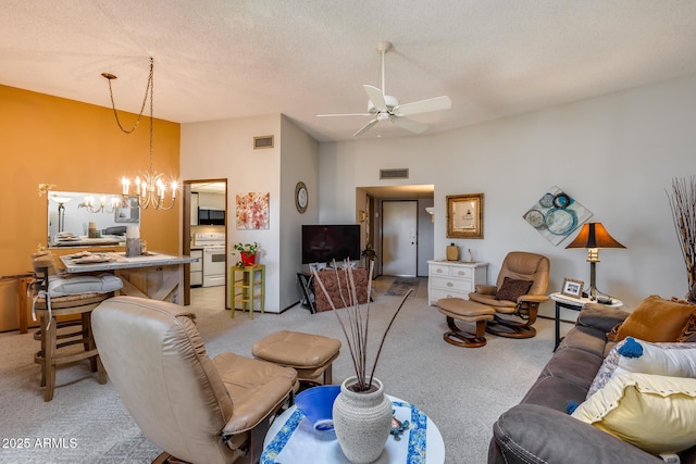 living room with lofted ceiling, ceiling fan with notable chandelier, light colored carpet, and a textured ceiling