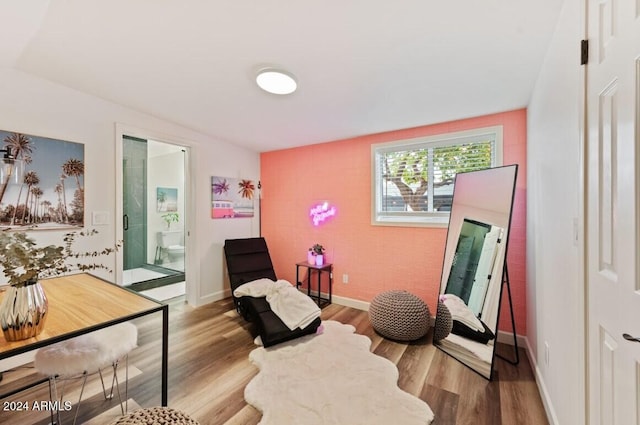 sitting room with hardwood / wood-style floors