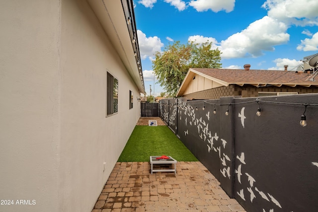 exterior space featuring a lawn and a patio area