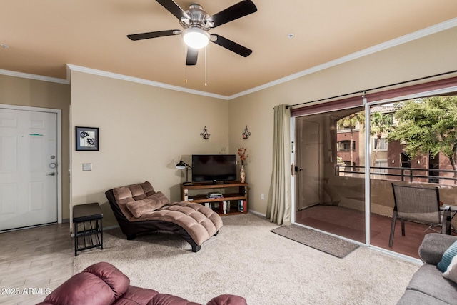 living room featuring baseboards, ceiling fan, and crown molding