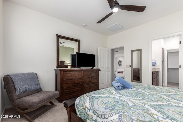 carpeted bedroom featuring ceiling fan and connected bathroom