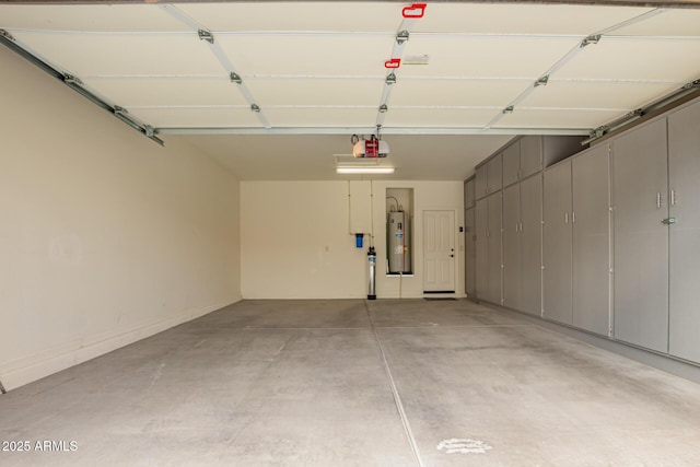garage with water heater and a garage door opener