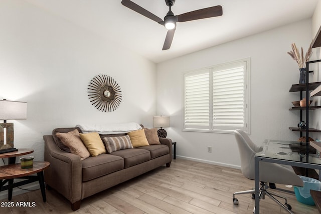 office area with ceiling fan, light wood-style floors, and baseboards