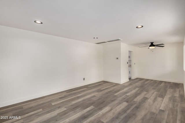 unfurnished room with visible vents, baseboards, dark wood finished floors, a ceiling fan, and recessed lighting