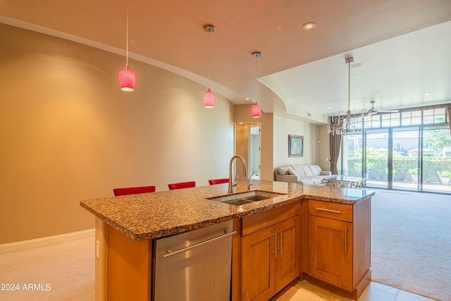 kitchen with dishwasher, light stone counters, sink, light carpet, and decorative light fixtures