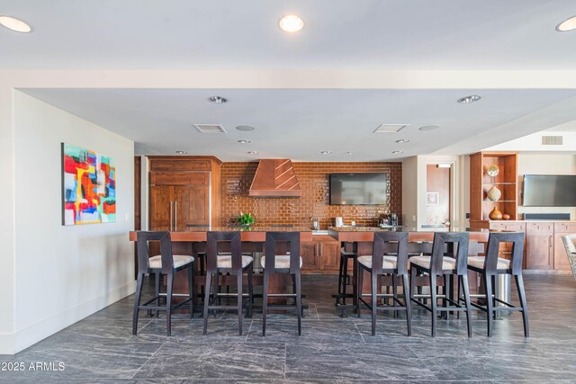 carpeted living room with ceiling fan with notable chandelier