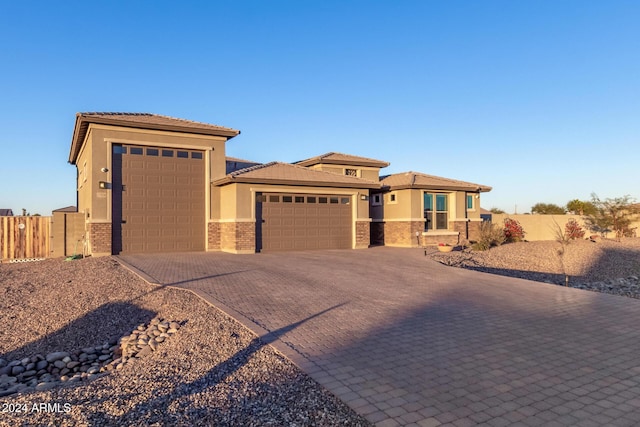 prairie-style home featuring a garage