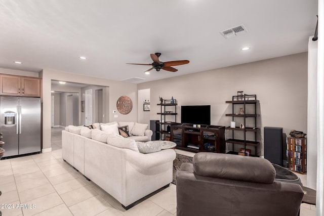 tiled living room featuring ceiling fan