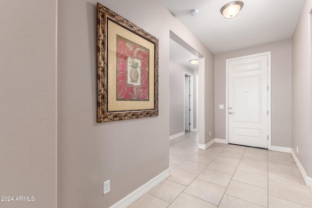 hallway featuring light tile patterned floors