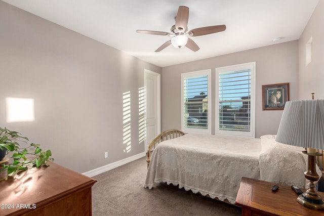 bedroom featuring ceiling fan and carpet